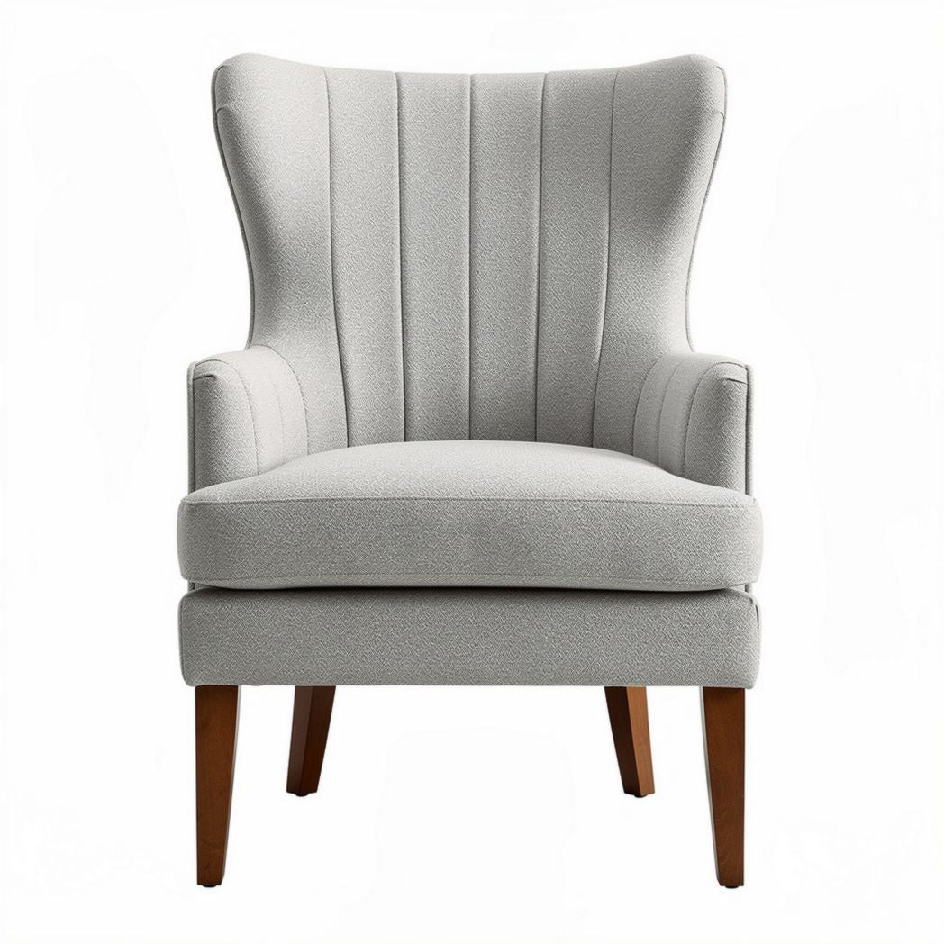 Upholstered wingback accent chair in light gray fabric with wooden legs